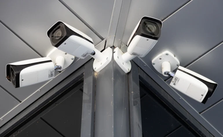 bottom-view-close-up-four-white-surveillance-cameras
